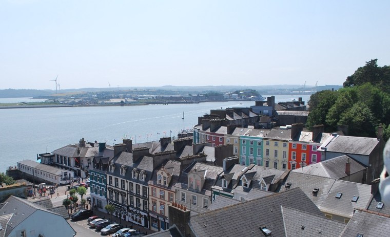 Colorful houses and the Titanic experience museum of Cobh right by the sea.