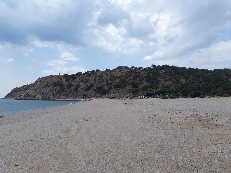Large, empty beach with a tavern.