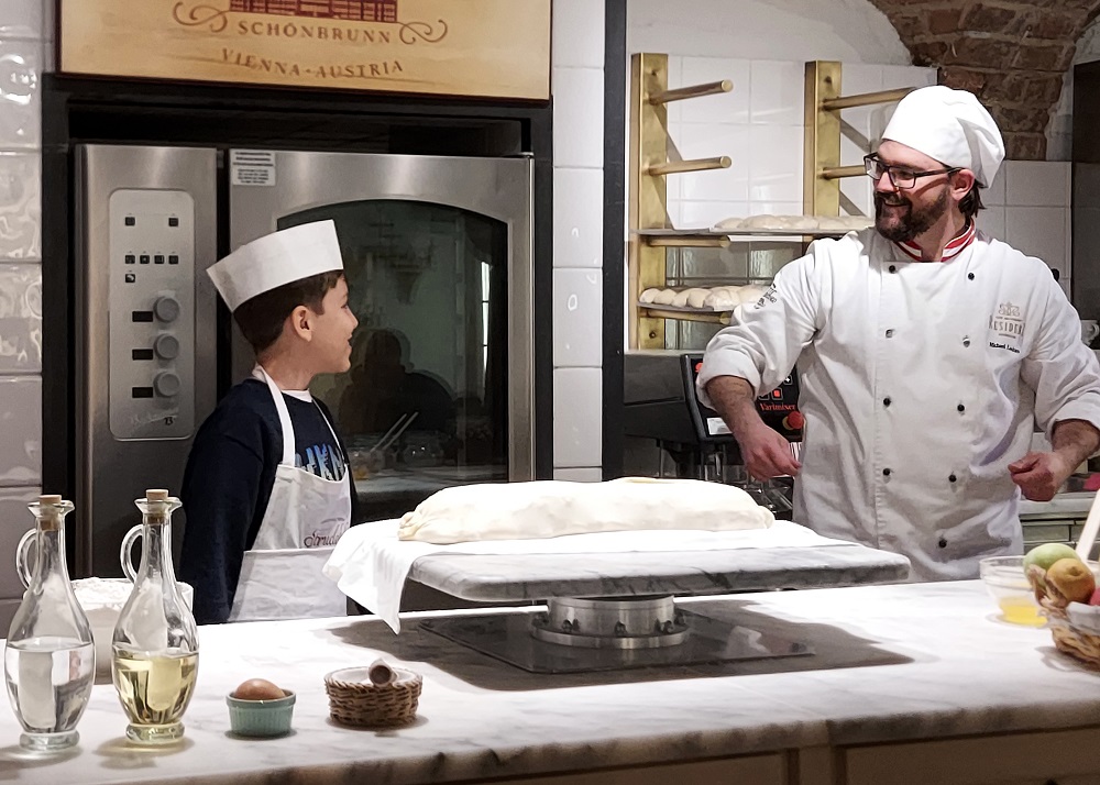 The confectioner has invited a boy to help him