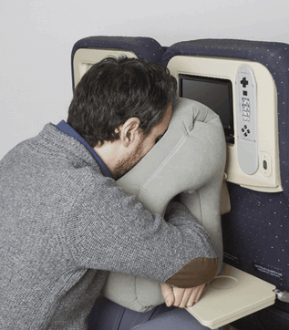 kill time on long flights by sleeping on airplane